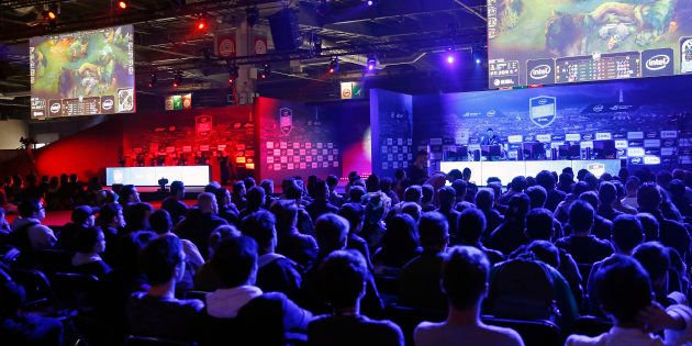 Fans watch an electronic video game tournament with the game 'League of Legends' developed by Riot Games during the 'Paris Games Week' on October 28, 2016 in Paris, France. '