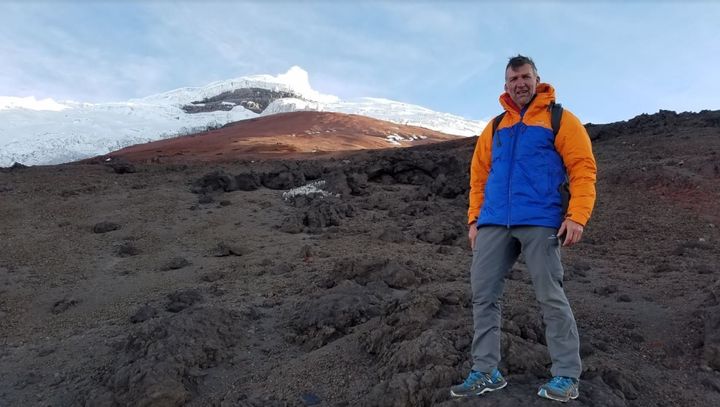 Tim on a glacier-capped mountain in Ecuador.