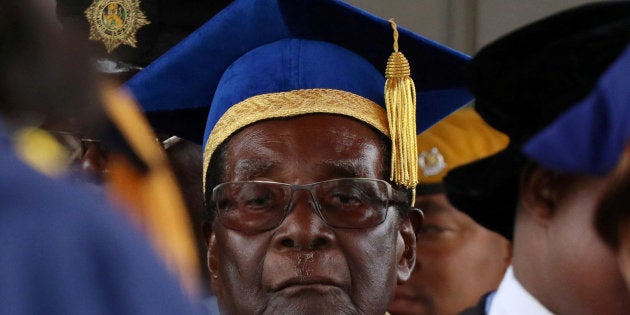 Zimbabwe President Robert Mugabe attends a university graduation ceremony in Harare, Zimbabwe, November 17, 2017. REUTERS/Philimon Bulawayo TPX IMAGES OF THE DAY