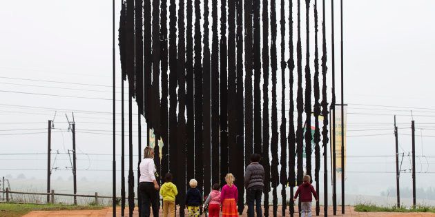 Community members visit the Nelson Mandela Capture Site memorial in Howick, on the anniversary of the late former president's death, December 5 2014.