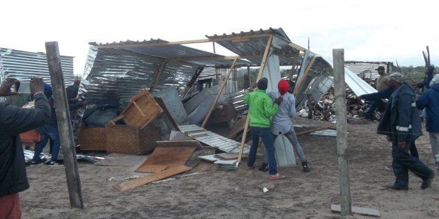 Residents of Siyahlala informal settlement tore down this shack because an immigrant was living in it with his South African wife.