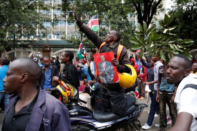 Jubilee Party supporters celebrate after Kenya's Supreme Court upheld the re-election of President Uhuru Kenyatta in last month's repeat presidential vote, in Nairobi, Kenya November 20, 2017.
