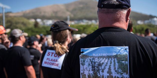 South African farmers and farm workers attend a demonstration at the Green Point stadium to protest against farmer murders in the country, on October 30, 2017, in Cape Town.