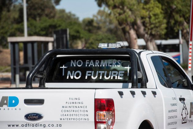 A picture shows a slogan on a pick up truck during a demonstration by South African farmers & farm workers at the Green Point stadium to protest against farmer murders in the country, on October 30, 2017, in Cape Town.