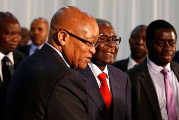 South African president Jacob Zuma (L) gestures as he hosts his Zimbabwean counterpart, President Robert Mugabe during the 2nd Session of the South Africa-Zimbabwe Bi-National Commission in Pretoria, South Africa, October 3, 2017.