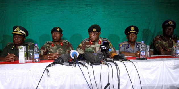 Commander of Zimbabwe Defence Forces General Costantino Chiwenga (C) addresses the media with other security chiefs in Harare, Zimbabwe November 20, 2017.