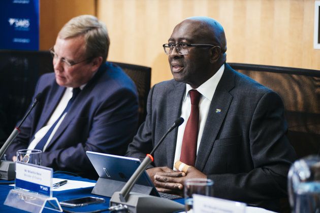 Mark Kingon, acting commissioner for the South African Revenue Service (SARS), left, and Nhlanhla Nene, South Africa's finance minister, attend a news conference in Pretoria, South Africa, on Tuesday, April 3, 2018. South Africa's tax agency collected 1.216 trillion rand ($101.3 billion) in the year through March, slightly below target. Photographer: Waldo Swiegers/Bloomberg via Getty Images