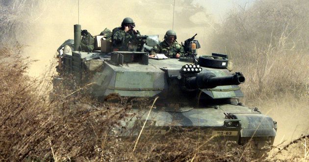 United States soldiers conduct a military drill in Chonkok, north of Seoul, March 27 2002, as part of joint annual U.S.-South Korea military exercises.