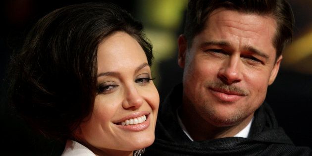 U.S. actors Brad Pitt and his partner Angelina Jolie pose for photographers on the red carpet at the German premiere of the movie