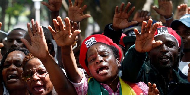 Protesters calling for Zimbabwean President Robert Mugabe to resign attend a prayer meeting outside parliament in Harare, Zimbabwe, November 21, 2017.