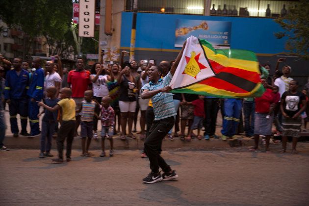 Zimbabweans living in South Africa celebrate after President Robert Mugabe resigns, in Johannesburg, South Africa November 21, 2017.