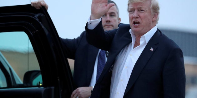 U.S. President Donald Trump speaks to reporters as he arrives aboard Air Force One from Singapore at Joint Base Andrews, Maryland, U.S. June 13, 2018. REUTERS/Jonathan Ernst