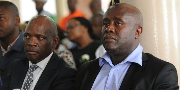 Hlaudi Motsoeneng and SABC CEO James Aguma during the funeral service of Robert Marawa's father Frank on December 10, 2016.