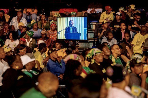 Supporters and community members listen as South African Deputy President and ruling party African National Congress (ANC) presidential candidate Cyril Ramaphosa gives a public lecture at the Orlando Communal Hall on November 13, 2017 in Johannesburg, South Africa.