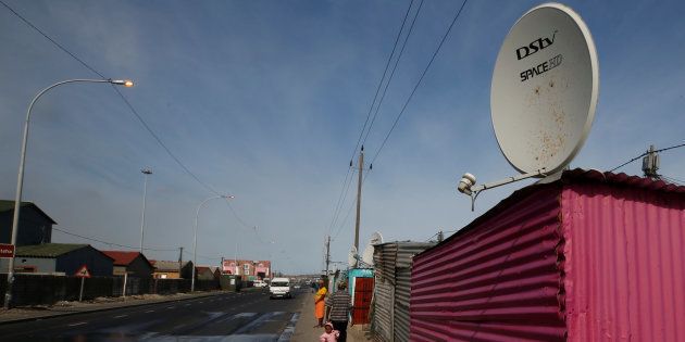 A satellite dish connecting residents to South Africa's DSTV television network, owned by telecommunications giant Naspers, adorns a shack in Khayelitsha township, Cape Town, May 25, 2017.
