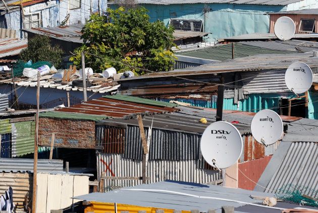 Satellite dishes connect township residents to South Africa's DSTV television network, owned by telecommunications giant Naspers, in Khayelitsha township, Cape Town, May 19, 2017.