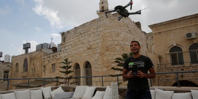 Nuseir Yassin flies his drone in the old city of the West Bank city of Bethlehem March 2, 2017.