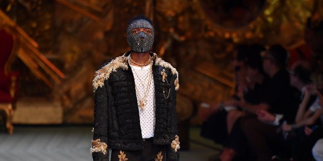 Wizkid walks the runway at the Dolce & Gabbana show during Milan Men's Fashion Week Spring/Summer 2019 on June 16 2018 in Milan, Italy.
