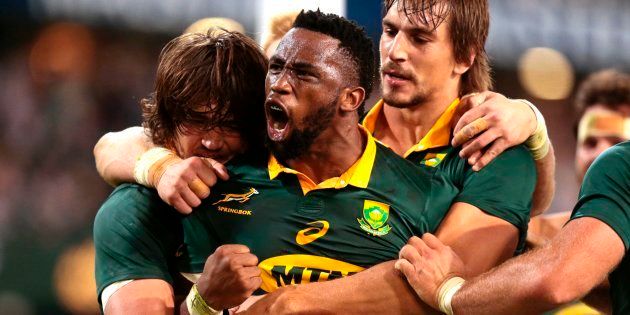 Siya Kolisi (C) celebrates after scoring a try against France during the Test match between South Africa and France at Kings Park in Durban on June 17 2017.