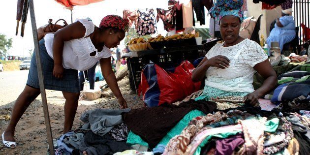 A woman sells clothes at a flea market outside SASSA pay point in March 2017 in Mpumalanga.