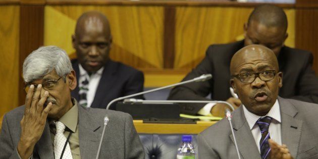 Former SABC board member Krish Naidoo, left, is back on the interim board. Naidoo and Vusi Mavuso, right, resigned during the board’s parliamentary hearing in October 2016, citing incomptency and erosion in the SABC’s governance. Behind them is former SABC COO Hlaudi Motsoeneng, the man at the centre of many of SABC’s problems.