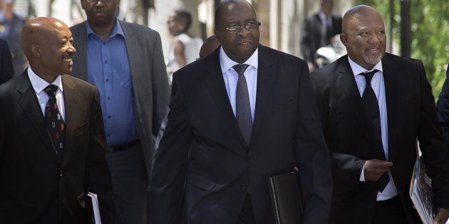 Previous finance minister Nhlanhla Nene (C) with Commissioner of the South African Revenue Service Tom Moyane (L) and former deputy finance minister Mcebisi Jonas.