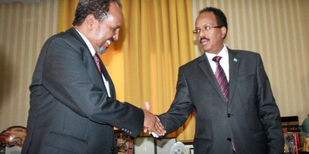 Somalia’s President Mohamed Abdullahi Farmajo (right) with outgoing President Hassan Sheik Mohamud.