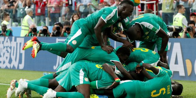 Soccer Football - World Cup - Group H - Poland vs Senegal - Spartak Stadium, Moscow, Russia - June 19, 2018. Senegal's M'Baye Niang celebrates scoring their second goal with teammates.