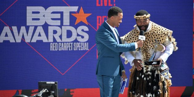 Host Terrence J (L) presents the International Viewers' Choice award for Best New Act to Sjava onstage at Live! Red! Ready! Pre-Show, sponsored by Nissan, at the 2018 BET Awards at the Microsoft Theatre on June 24 in Los Angeles, California.