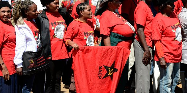 Supporters of the South African Communist Party (SACP), wearing t-shirts of the late anti-apartheid activist Chris Hani attend the 20th anniversary of the assassination of Chris Hani on April 10, 2013 at the Thomas Titus Nkombi Memorial Park in Elspark.