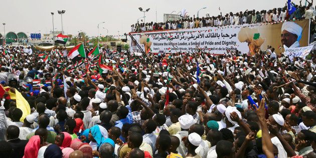Supporters welcome Sudan's President Omar al-Bashir during a rally against the International Criminal Court at Khartoum Airport in Sudan, July 30, 2016.