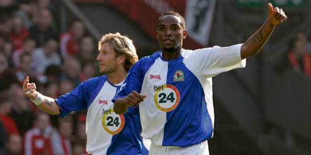 Former Blackburn Striker Benni McCarthy (R) celebrates with Robbie Savage after scoring during their English Premier League soccer match against Liverpool at Anfield in Liverpool.