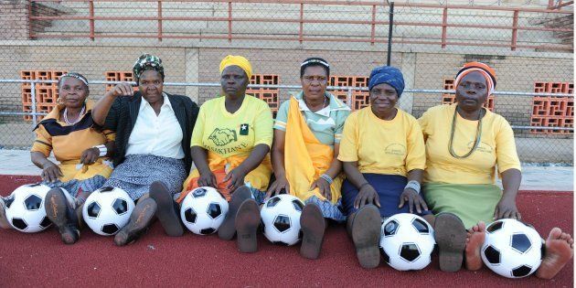 South African grandmothers pose with footballs in the Nkowankowa township on November 24 2009, in Tzaneen.