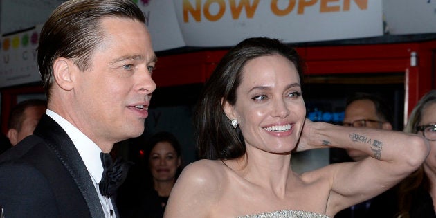 HOLLYWOOD CA - NOVEMBER 5: Director/Actress Angelina Jolie Pitt (R) and actor/producer Brad Pitt pose during the opening night gala premiere of Universal Pictures' 'By the Sea'' during AFI FEST 2015 presented by Audi at TCL Chinese 6 Theaters November 5, 2015, in Hollywood, California. (Photo by Kevork S. Djansezian/Getty Images)