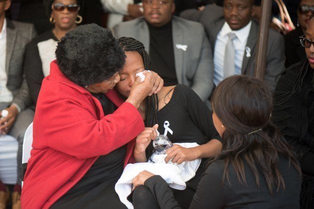 Relatives and friends react as they attend the memorial service for Karabo Mokoena (22) held at Diepkloof Multi-Purpose Hall on May 19, 2017 in Johannesburg, South Africa.