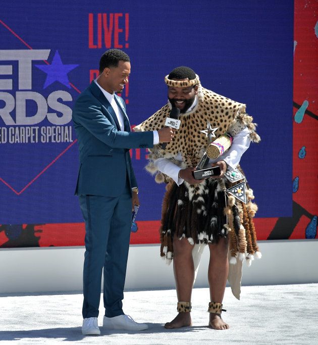 LOS ANGELES, CA - JUNE 24: Host Terrence J (L) presents the International Viewer's Choice award for Best New Act to Sjava onstage at Live! Red! Ready! Pre-Show, sponsored by Nissan, at the 2018 BET Awards at Microsoft Theater on June 24, 2018 in Los Angeles, California. (Photo by Neilson Barnard/Getty Images for BET)