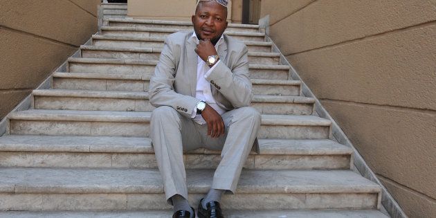 JOHANNESBURG, SOUTH AFRICA - OCTOBER 17: (SOUTH AFRICA OUT) Controversial businessman Kenny Kunene talks to City Press newspaper on October 17, 2012 in Johannesburg, South Africa. He spoke about his upcoming birthday, revealing his plans of 'spending less than R2 million' on five parties. (Photo by Lucky Nxumalo/City Press/Gallo Images/Getty Images)