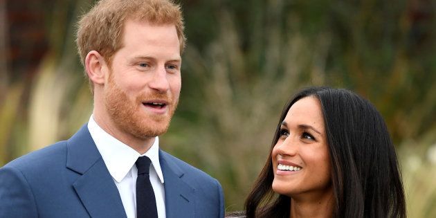 Britain's Prince Harry poses with Meghan Markle in the Sunken Garden of Kensington Palace, London, Britain, November 27, 2017.