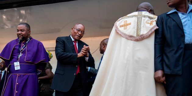 Jacob Zuma greets South African religious leaders and a crowd of supporters before addressing them outside the KwaZulu-Natal High Court in Durban on April 6 2018.