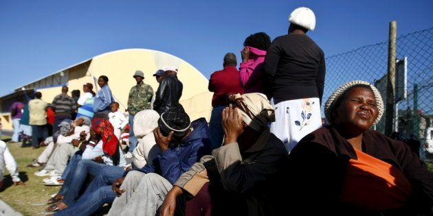 People queue to register for government grants in Cape Town, South Africa.