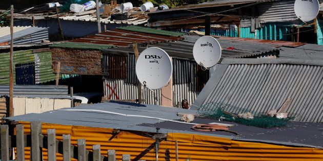 Satellite dishes connect township residents to South Africa's DSTV television network, owned by telecommunications giant Naspers, in Khayelitsha township, Cape Town, May 19, 2017. REUTERS/Mike Hutchings