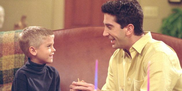 385848 23: Actors Cole Mitchell Sprouse (Big Daddy) as Ben and David Schwimmer as Ross Geller star in NBC's comedy series 'Friends' episode 'The One with the Holiday Armadillo.' Ross has Ben for the holidays and decides that this season, they will celebrate Chanukah instead of Christmas. (Photo by Warner Bros. Television)