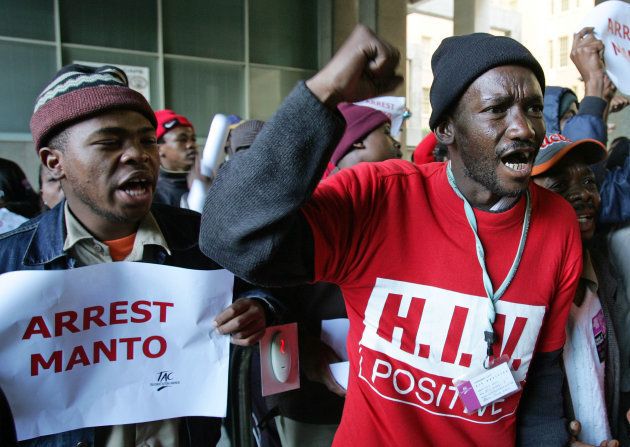 Members of South Africa's HIV/AIDS Treatment Action Campaign (TAC) group protest outside government offices during a countrywide protest day in Cape Town August 24, 2006. The protestors called for the dismissal and arrest of then-health minister Manto Tshabalala-Msimang.