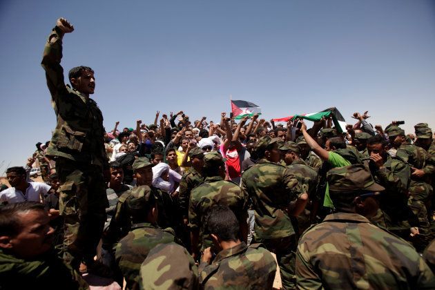 Indigenous Sahrawi people react during the funeral of Western Sahara's Polisario Front leader Mohamed Abdelaziz in Tindouf, Algeria June 3, 2016.