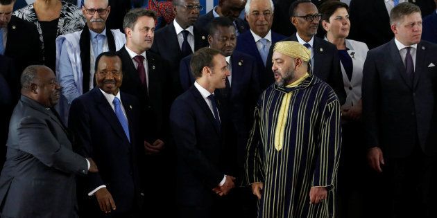 Gabon's President Ali Bongo Ondimba, Cameroon's President Paul Biya, France's President Emmanuel Macron and King of Morocco Mohammed VI talk while they prepare to pose for photographers during the 5th African Union - European Union (AU-EU) summit in Abidjan, Ivory Coast November 29, 2017. REUTERS/Luc Gnago