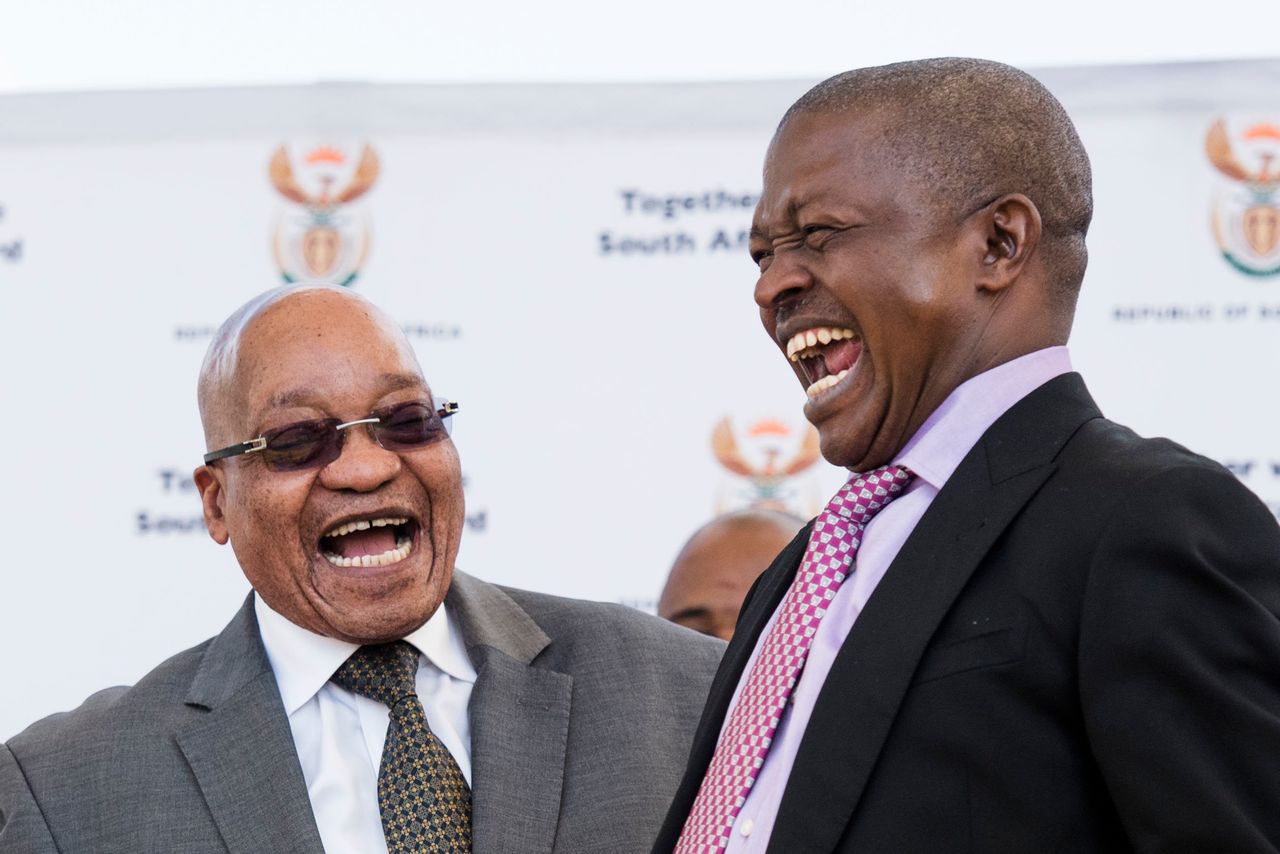 President Jacob Zuma has a moment of laughter with the Mpumalanga Premier; David Mabuza during the Kruger National Park land claims settlement ceremony on May 22, 2016.