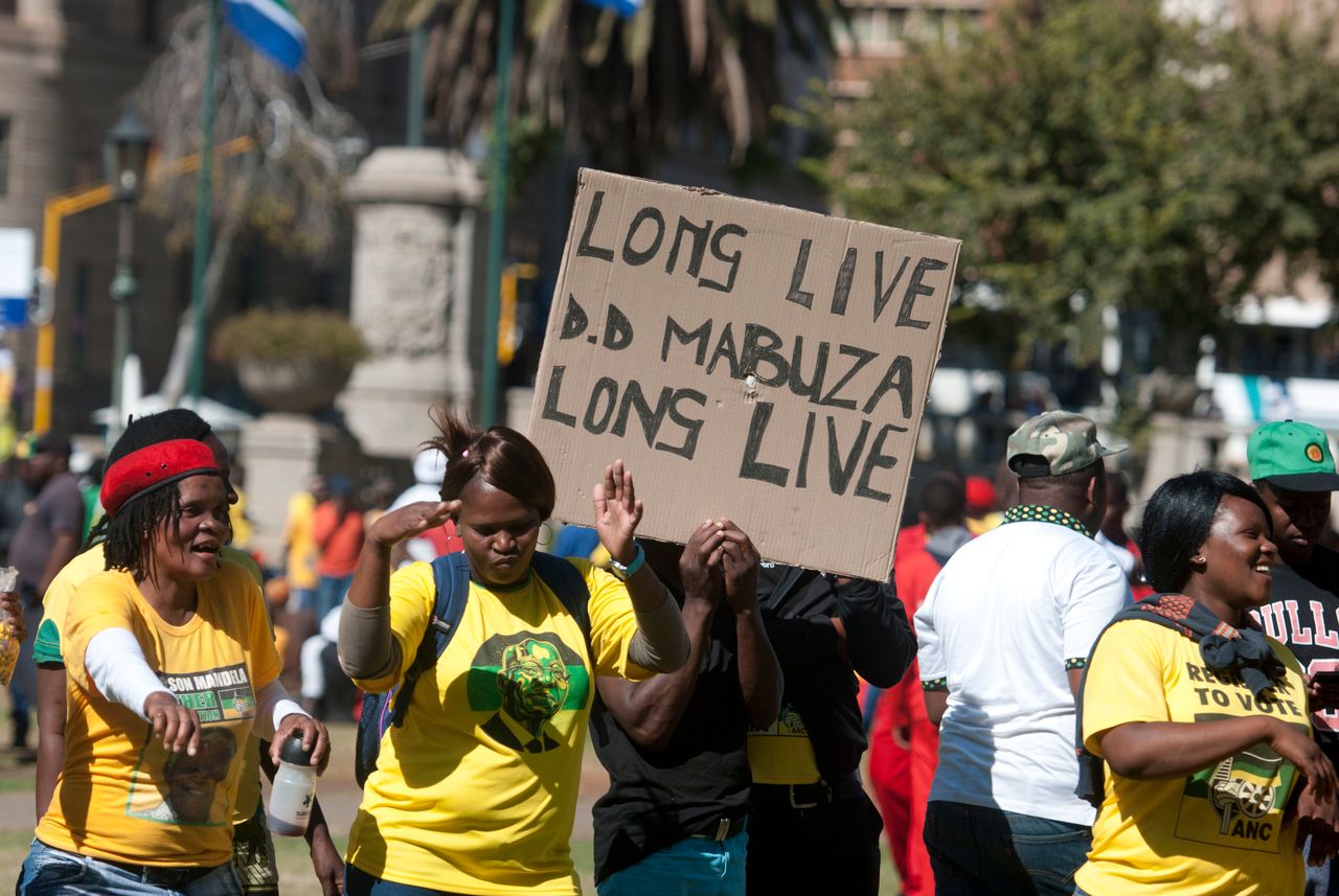 African National Congress (ANC) members gather outside the North Gauteng High Court in support of the Premier of Mpumalanga; David Mabuza during the hearing of a civil claim case between him and Mathews Phosa on May 12, 2016 in Pretoria, South Africa.