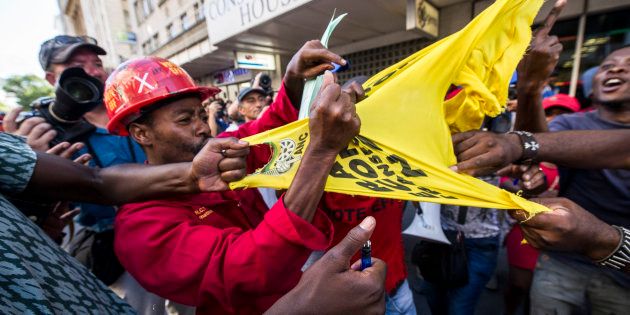 Economic Freedom Fighters supporters tear an ANC t-shirt outside Parliament during President Jacob Zumaï's State of the Nation Address.