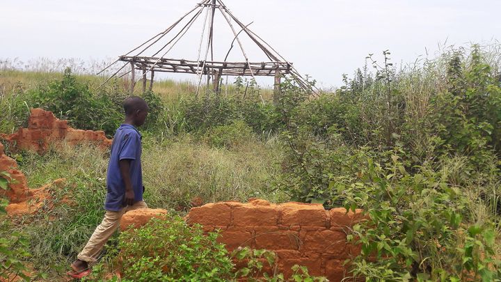 A boy walks past the ruins of the destroyed house of customary chief Kamuina Nsapu, whose death last August sparked months of deadly fighting between the government army and Kamuina Nsapu's militia in Tshimbulu near Kananga, the capital of Kasai-central province of the Democratic Republic of Congo, March 11, 2017.