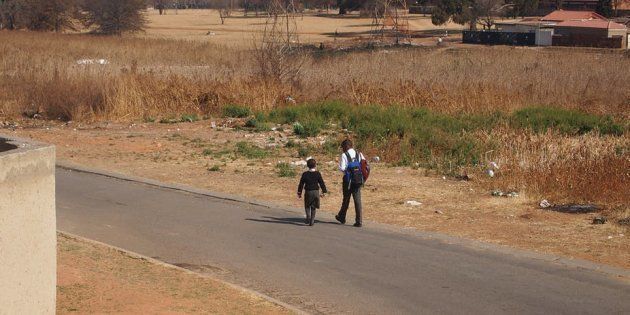 Children across South Africa often walk long distances to school and back.